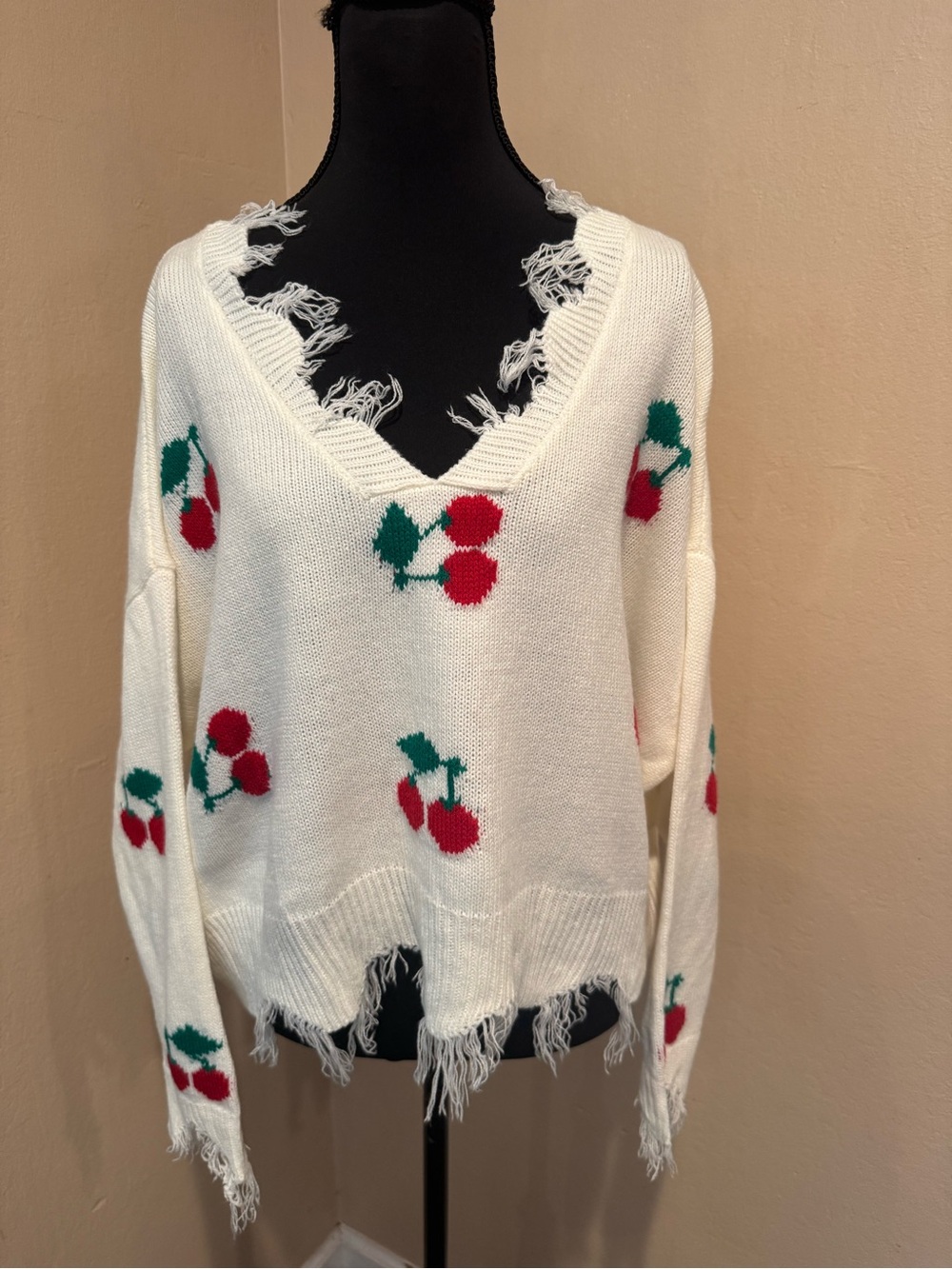White V-Neck Cropped Sweater with Red Cherry Motif and Distressed Frayed Edges